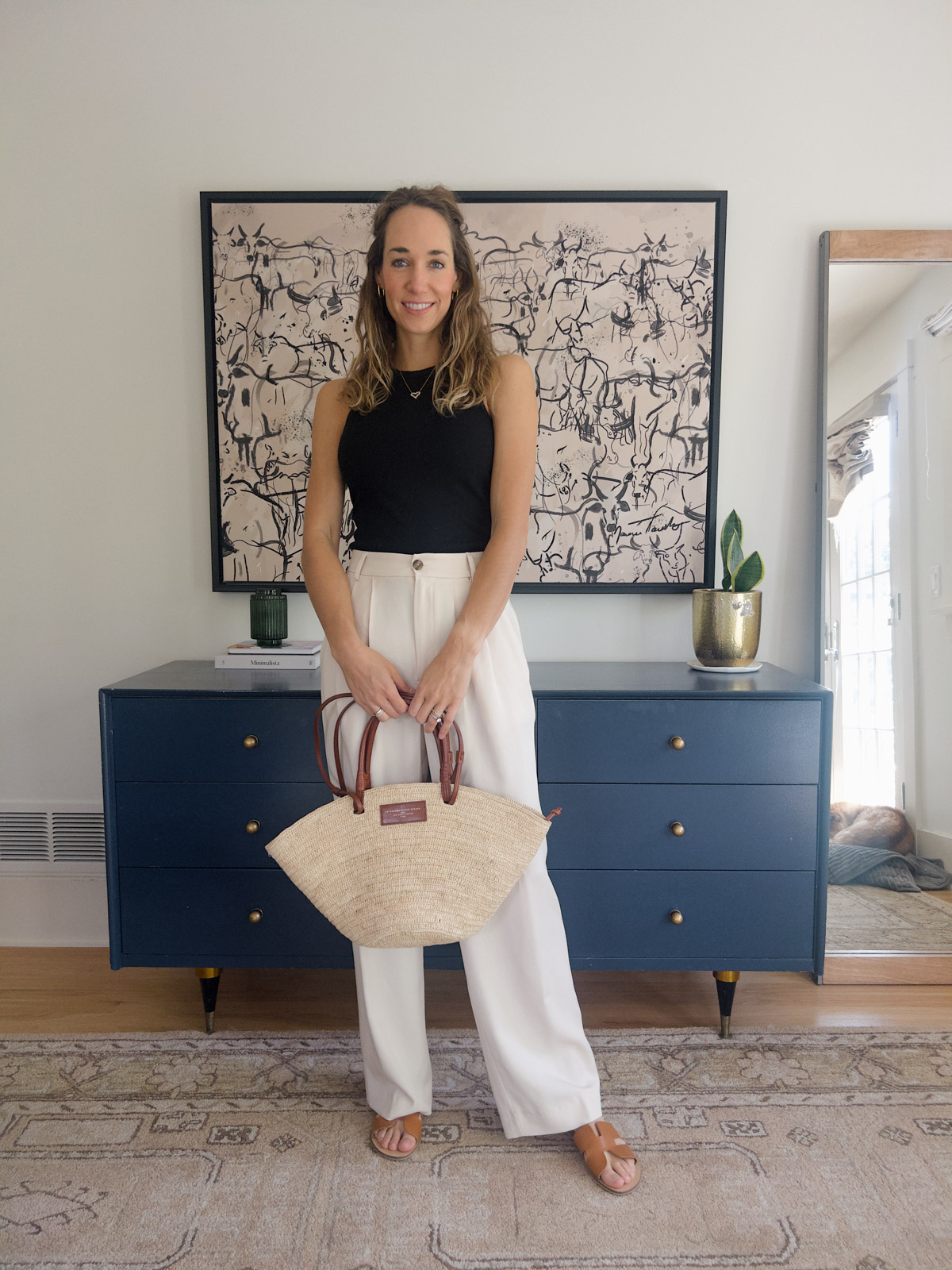 white pants outfit with a black tank top